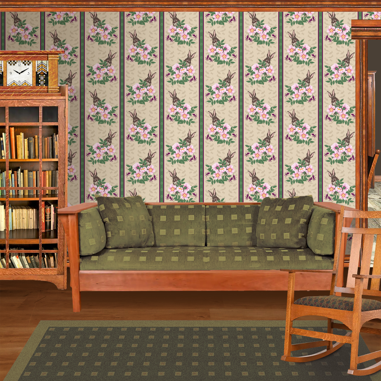 The artwork depicts a stylized brown hare partially concealed behind a cluster of green leaves and pink flowers with yellow centers. The background is dark green with subtle leafy patterns. Two vertical stripes—one dark purple and one green with small floral motifs—run along the left side, contrasting with the otherwise naturalistic elements. The composition balances the lively flora and fauna with a decorative, patterned design. The wallpaper design is shown in a Mission style living room